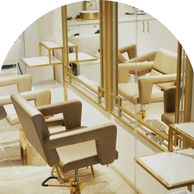Modern salon interior with beige chairs.